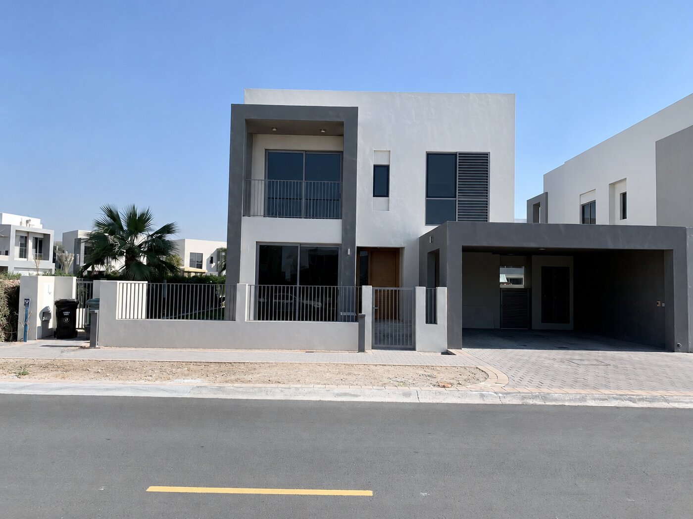 Dubai Hills Estate villa front exterior before landscaping — bare handover plot