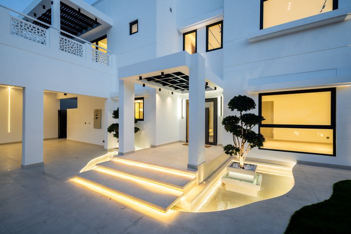 Entrance Water Feature at Dusk &mdash; completed Crownstone villa renovation, Dubai