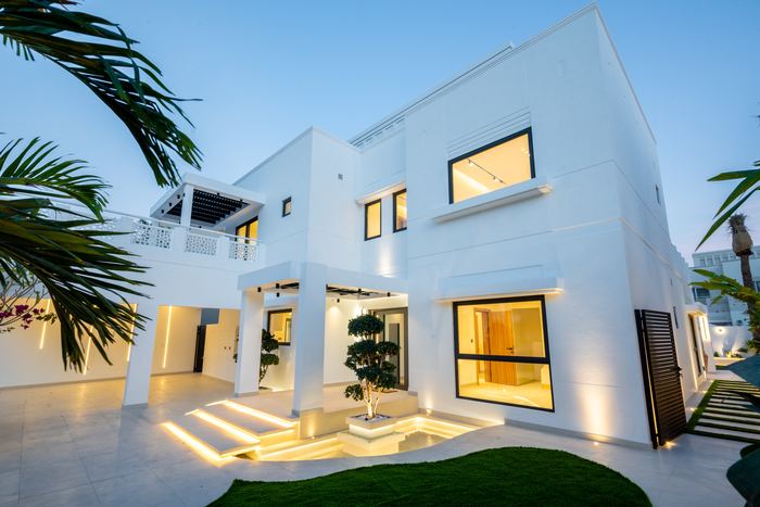Facade at Dusk with Palms &mdash; completed Crownstone villa renovation, Dubai
