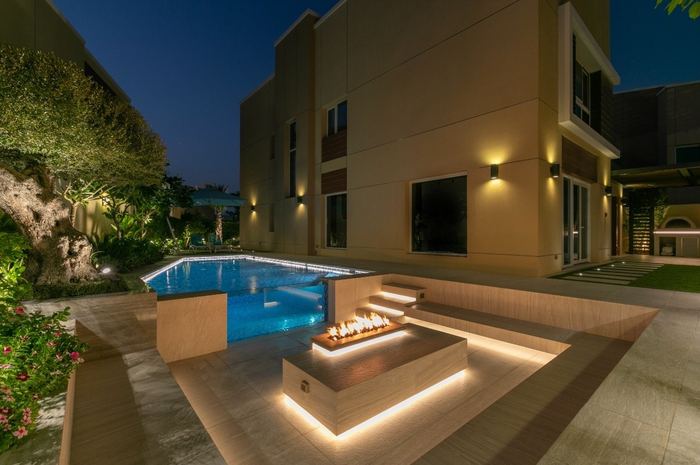 Pool & Fire Pit Terrace at Dusk &mdash; completed Crownstone villa renovation, Dubai