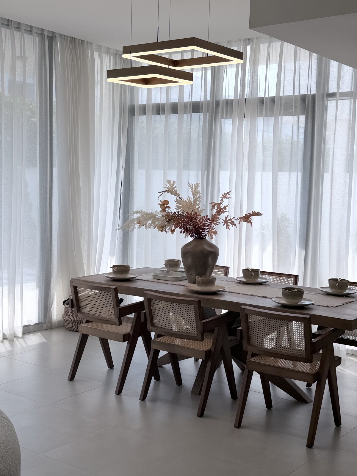Palm Jumeirah townhouse dining table styled with pendant lighting after renovation
