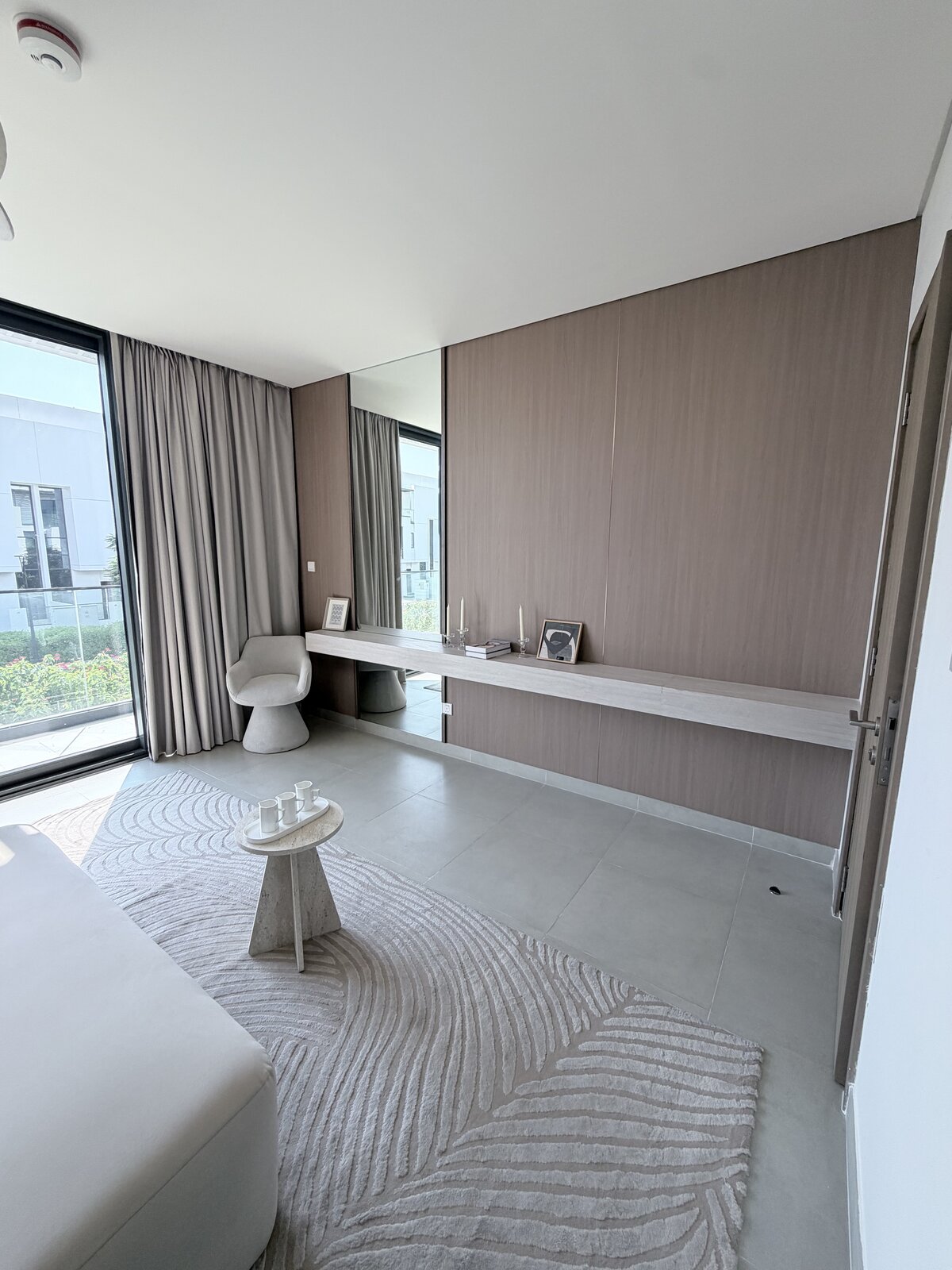 Palm Jumeirah townhouse dressing area after renovation — mirrored console, styled seating and decor