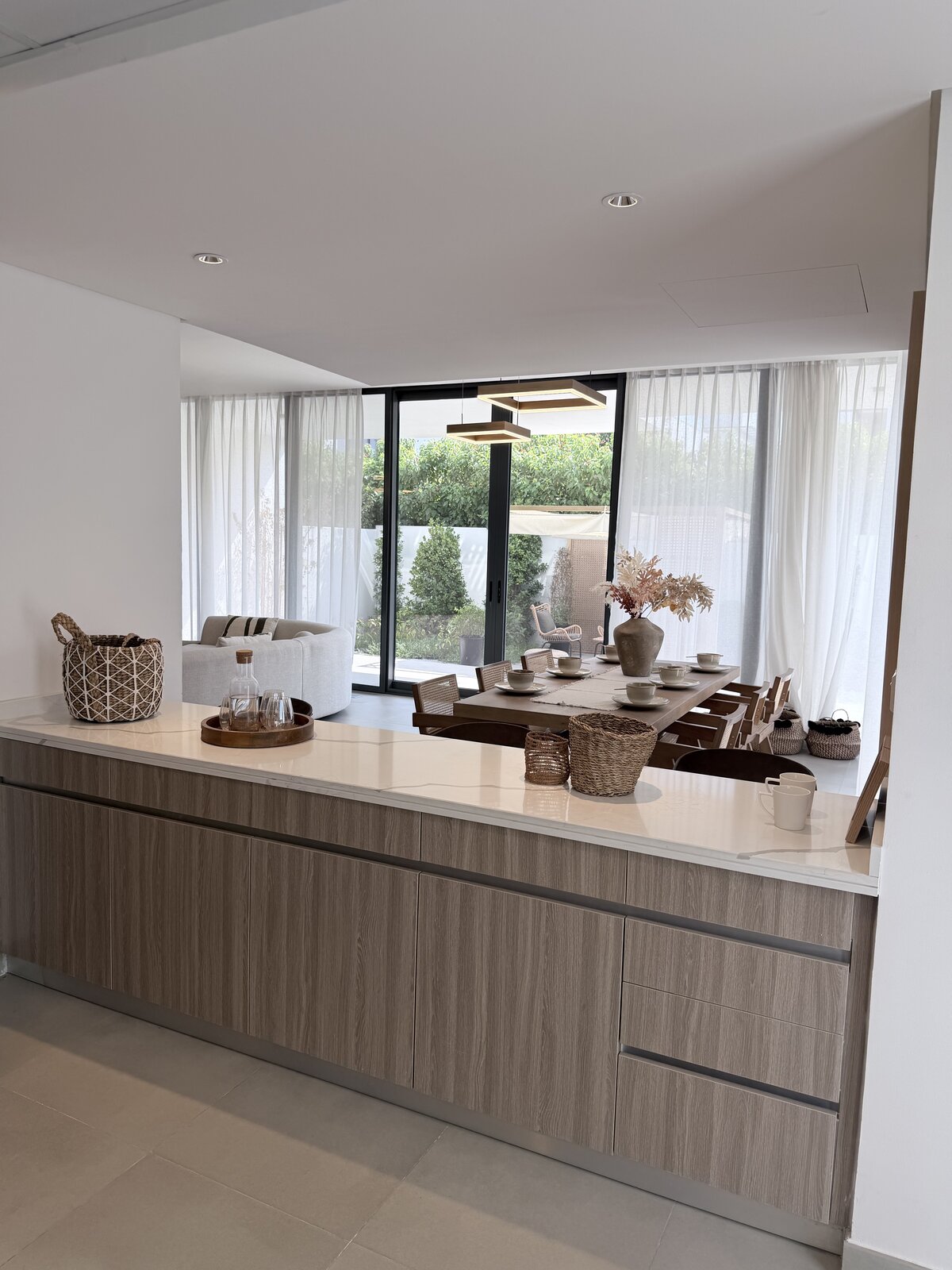 Palm Jumeirah townhouse renovation — open-plan kitchen and dining after renovation, Crownstone