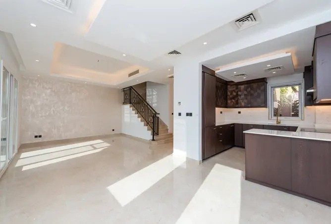 Arabian Ranches villa living room after renovation — refreshed open-plan living space